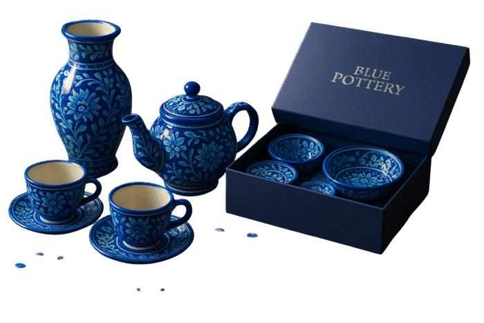 Handcrafted blue pottery bowl with intricate floral design.